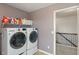 Convenient laundry room with modern washer and dryer set at 12811 Corydon Dr, Fishers, IN 46037