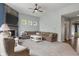 Comfortable living room featuring a stone fireplace, large sectional, and a cozy seating area at 12811 Corydon Dr, Fishers, IN 46037