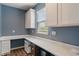 Functional office space with built-in cabinetry, ample counter space, and a bright window for natural light at 12811 Corydon Dr, Fishers, IN 46037