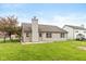 Backyard featuring well-maintained lawn, patio, and fenced perimeter at 1283 Easton Point Dr, Greenwood, IN 46142