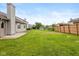 Spacious backyard offering lush green grass, patio area, and privacy fencing at 1283 Easton Point Dr, Greenwood, IN 46142