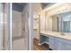 Bright bathroom featuring a glass enclosed shower, dual vanity, and ample storage at 1283 Easton Point Dr, Greenwood, IN 46142