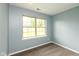 Cozy bedroom featuring natural light from the window and neutral-toned carpet at 1283 Easton Point Dr, Greenwood, IN 46142