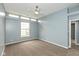 Cozy bedroom featuring neutral carpet, ceiling fan, and sunny windows at 1283 Easton Point Dr, Greenwood, IN 46142