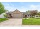 Charming single-story home with brick accents, a well-manicured lawn, and an attached two-car garage at 1283 Easton Point Dr, Greenwood, IN 46142