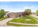 Beautiful single-story home with a brick facade, lush green lawn, and a convenient two-car garage at 1283 Easton Point Dr, Greenwood, IN 46142
