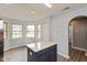Eat-in kitchen featuring stainless steel fridge, a center island, and a breakfast nook at 1283 Easton Point Dr, Greenwood, IN 46142