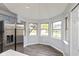 Eat-in kitchen with stainless steel fridge, breakfast nook, and wood-look flooring at 1283 Easton Point Dr, Greenwood, IN 46142
