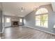 Spacious living room featuring a brick fireplace, high ceilings, and large windows for natural light at 1283 Easton Point Dr, Greenwood, IN 46142