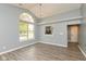 Bright living room with large window and pass-through to kitchen at 1283 Easton Point Dr, Greenwood, IN 46142