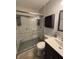 Bathroom featuring a walk-in shower with a glass door and subway tile and a modern vanity with updated fixtures at 1513 Ashley Dr, Lebanon, IN 46052