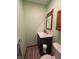 Efficient half-bathroom features modern fixtures and space-saving design, ideal for guests at 1513 Ashley Dr, Lebanon, IN 46052