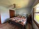 Comfortable bedroom features ceiling fan, closet, and natural light from a large window at 1513 Ashley Dr, Lebanon, IN 46052