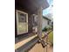 A charming covered front porch with stone details, a 'Welcome' mat, and an inviting entrance at 1513 Ashley Dr, Lebanon, IN 46052