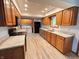 Well-lit kitchen with stainless steel appliances, oak cabinets, and granite countertops at 1513 Ashley Dr, Lebanon, IN 46052