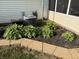 Beautiful landscaping featuring healthy bushes and a well-kept garden, enhancing the home's curb appeal at 1513 Ashley Dr, Lebanon, IN 46052