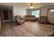 Comfortable living room featuring new floors and neutral-toned furnishings, creating a welcoming space at 1513 Ashley Dr, Lebanon, IN 46052