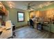 Functional office space with a ceiling fan and built-in storage solutions, perfect for productivity at 1513 Ashley Dr, Lebanon, IN 46052