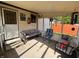 Inviting sunroom with comfortable seating, wind chimes, and plenty of natural light from large windows at 1513 Ashley Dr, Lebanon, IN 46052