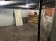 Unfinished basement offering potential for storage or customization with concrete floors and block walls at 1618 California St, Columbus, IN 47201