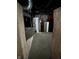 Basement with a water heater, filtration system, exposed ductwork, and concrete floors at 1618 California St, Columbus, IN 47201