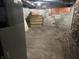Unfinished basement area ideal for storage, featuring exposed brick, concrete walls, and ample open space at 1618 California St, Columbus, IN 47201