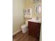 Bathroom with a vanity, commode, and wall cabinet at 1618 California St, Columbus, IN 47201