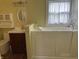 Accessible bathroom featuring a walk-in tub with safety features and a classic vanity with storage at 1618 California St, Columbus, IN 47201