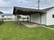 Carport next to the garage offers additional covered parking at 1618 California St, Columbus, IN 47201