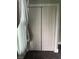 A closet featuring paneled double doors and white trim at 1618 California St, Columbus, IN 47201
