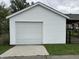 Spacious garage with a pristine white exterior offers ample parking at 1618 California St, Columbus, IN 47201