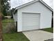 Well-maintained garage with a large door and concrete driveway offers convenience at 1618 California St, Columbus, IN 47201