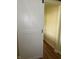 Entry hall with a white barn door slightly ajar at 1618 California St, Columbus, IN 47201