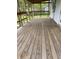 Spacious porch with wood flooring offers a great space for outdoor seating at 1618 California St, Columbus, IN 47201