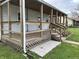 Charming porch with wood flooring and railings, perfect for relaxing outdoors at 1618 California St, Columbus, IN 47201