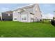 View of the backyard with green grass and a black fence around the property at 17951 Paula Walk, Westfield, IN 46074