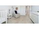 Bedroom with recliner, side table, and changing table with shelves at 17951 Paula Walk, Westfield, IN 46074