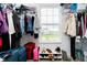 Walk-in closet with shelving, hanging rods, and a window offering natural light at 17951 Paula Walk, Westfield, IN 46074