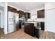 Well-lit kitchen with stainless steel appliances, dark cabinetry, and a functional island at 17951 Paula Walk, Westfield, IN 46074