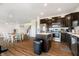 Open-concept kitchen featuring an island and stainless steel appliances, connected to dining area at 17951 Paula Walk, Westfield, IN 46074
