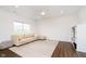 Bright living room featuring laminate floors, a comfortable couch, and ample space for relaxation and entertainment at 17951 Paula Walk, Westfield, IN 46074
