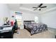 Primary bedroom with ceiling fan, tray ceiling, and large windows providing ample natural light at 17951 Paula Walk, Westfield, IN 46074