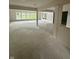 Spacious basement featuring ample natural light from the large windows overlooking the lush outdoors at 1915 Seaport Dr, Indianapolis, IN 46240