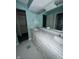 Bathroom featuring double sink vanity, framed mirror, and ceramic tile floor at 1915 Seaport Dr, Indianapolis, IN 46240