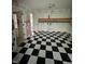 Bedroom with black and white checkered floors and painted murals on the walls at 1915 Seaport Dr, Indianapolis, IN 46240