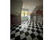 Bedroom with black and white checkered floors and painted murals on the walls at 1915 Seaport Dr, Indianapolis, IN 46240