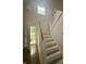 Entryway with a carpeted staircase and a chandelier adds charm to the home's interior at 1915 Seaport Dr, Indianapolis, IN 46240