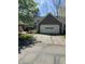 Home exterior featuring an attached garage, yellow siding, and well-maintained landscaping at 1915 Seaport Dr, Indianapolis, IN 46240