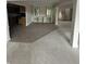 Spacious living room and dining room, with an open layout, built-in cabinets and staircase in view at 1915 Seaport Dr, Indianapolis, IN 46240