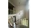 Foyer and staircase with decorative chandelier and white banisters at 1915 Seaport Dr, Indianapolis, IN 46240